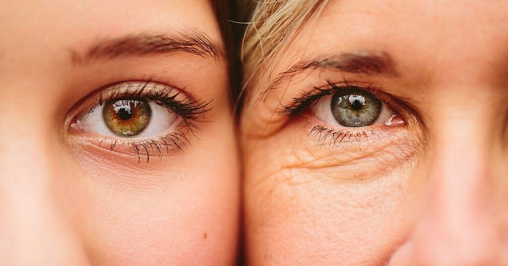 close up of mother and daughter faces together